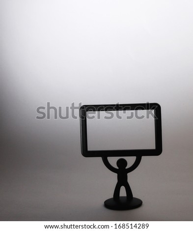plastic figurine of a man with a placard on white background