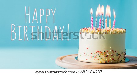 Delicious birthday cake with candle on light blue background. Space for text