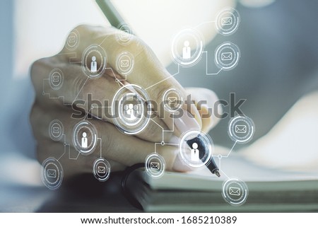 Social network media concept with woman hand writing in diary on background. Double exposure