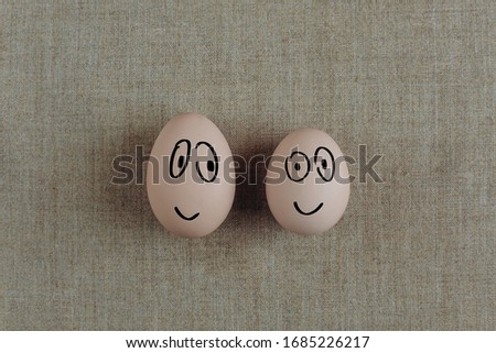 egg on a background with drawn emotions