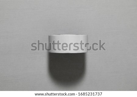Double-sided adhesive Tape on gray background.High resolution photo.