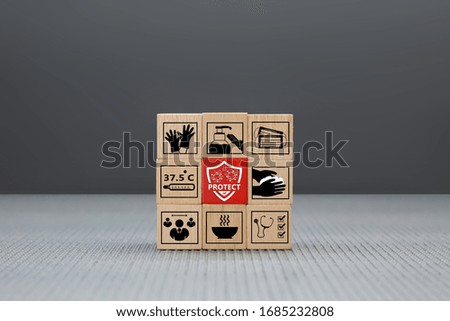 Covid-19 icon on wooden toy block. Concepts for health care and prevention of coronavirus infection, Social Distancing and stay home or work from home.