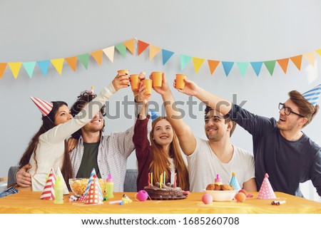 Happy Birthday party. A group of friends with a cake wishes the girl a happy birthday Royalty-Free Stock Photo #1685260708