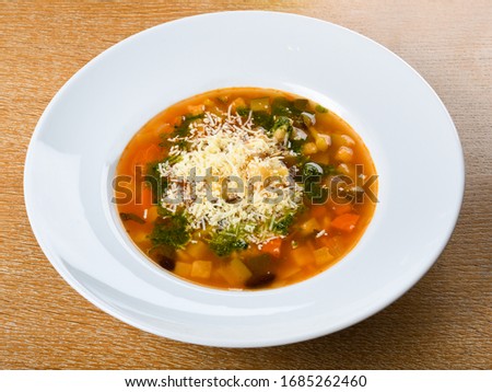 Minestrone is a thick soup of Italian origin made with vegetables, often with the addition of pasta or rice, sometimes both. Common ingredients include beans, onions, celery, carrots, stock, tomatoes