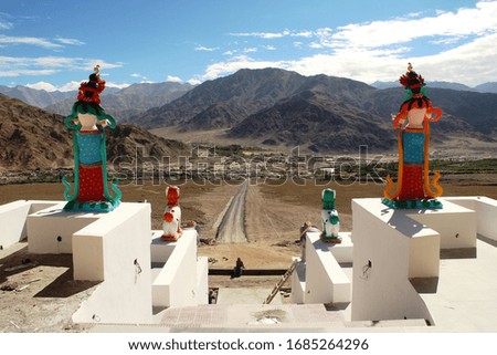 Welcoming Buddha Statue on the front of a Monastery, Leh-Ladakh