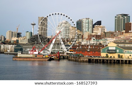 Waterfront Piers Dock Buildings Needle Ferris Wheel Seattle Elliott Bay Royalty-Free Stock Photo #168527393
