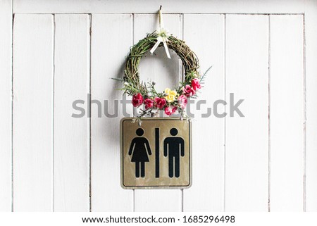 Flowers circle on white toilet door