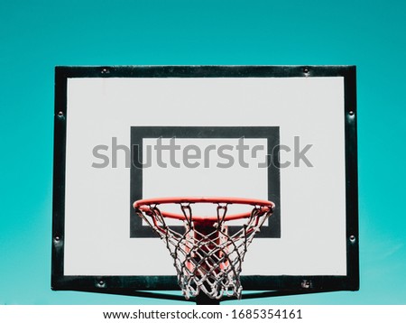 Basketball hoop on green background