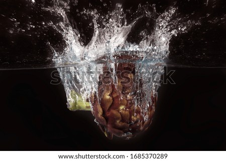 Roman artichoke in the splash water
