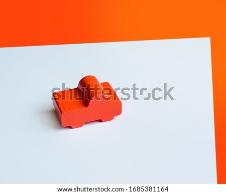 Pictures orange toy wooden car white and orange background