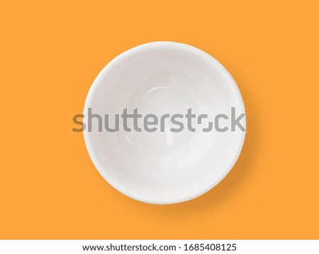 white bowl isolated include clipping path on orange background. stack image