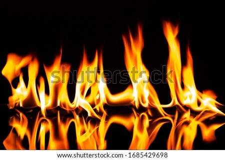 flame with reflection on a black background