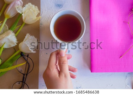 Pink tulips on the white background. Flat lay, top view. Valentines background.