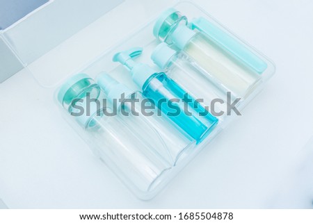 Cosmetic liquids in tranparent box. Liquid security check at Airport