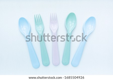 Isolated plastic kitchen utensils on white background