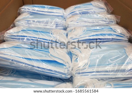 Due to the shortage of medical supplies due to the COVID-19 Coronavirus epidemic, boxes of medical masks were packed in boxes, ready to be shipped to hospitals for use by frontline doctors. Royalty-Free Stock Photo #1685561584