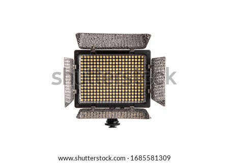 Photo and video lamp isolate on white background. LED lamp with special shutters for the formation of light flux. Photo and video lighting fixture.