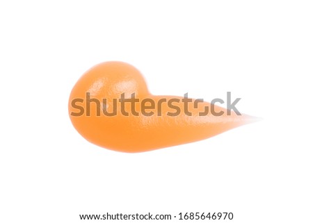 Orange or peach colored Transparent Gel smear or dpop on isolated white background. Moisturizing cream texture. Cosmetic or makeup cocept