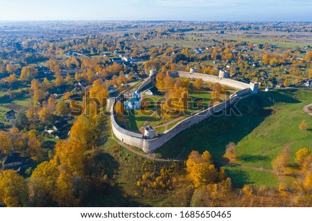 Medieval Izborsk fortress in autumn landscape on a sunny day. Pskov region, Russia