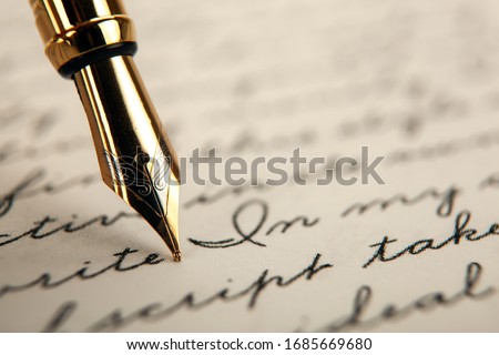 fountain pen on paper with ink text on the paper closeup Royalty-Free Stock Photo #1685669680