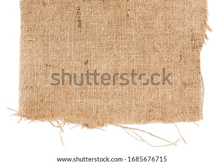 Brown burlap laying on white sheet. Abstract background. Texture of sackcloth. Background for banners, or wallpapers. Burlap Fabric Patch Piece, Rustic Hessian Sack Cloth Royalty-Free Stock Photo #1685676715