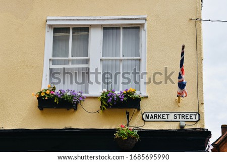 Exterior of an traditional house with flowers in front of the window in Windsor UK