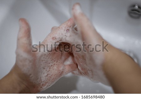 Child is washing hands, covid-19 