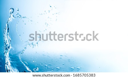 Water splashes with copy space, blue background