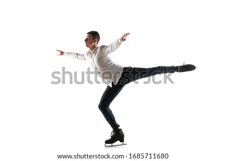 Man figure skating isolated on white studio backgound with copyspace. Professional practicing and training in action and motion on ice. Graceful and weightless. Concept of movement, sport, beauty.