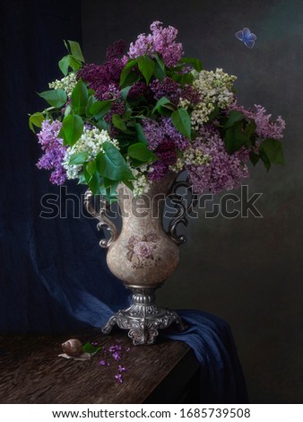Still life with splendid bouquet of colorful lilac