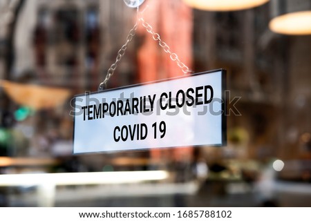 Store sign, temporarily closed. Coronavirus sign in a store. Royalty-Free Stock Photo #1685788102