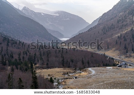 Views of the Baserca reservoir valley in winter, Aran Valley, Lleida, Catalonia, Spain.