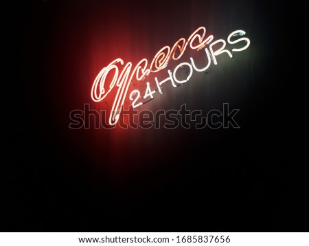 Neon sign glow light of open 24 hours in red and white color