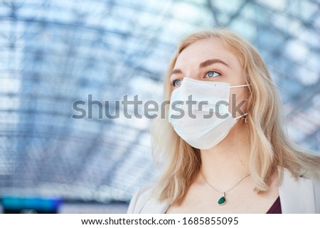 business woman standing in medical mask, koronavirus Royalty-Free Stock Photo #1685855095