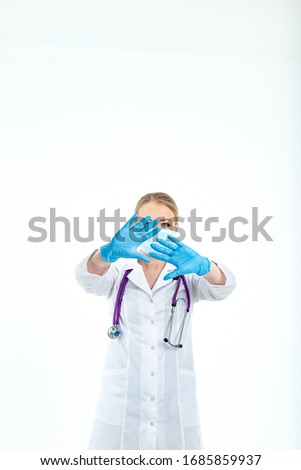 young man covering face with hand and putting other hand up front to stop camera, refusing photos or pictures. coronavirus concept