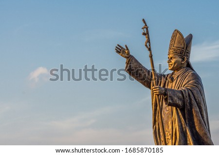 Statue of Pope John Paul II at the St. Thomas Mount National Shrine in Chennai shot during the golden hour.  Royalty-Free Stock Photo #1685870185
