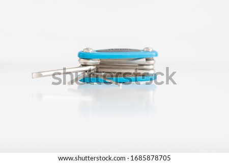 Steel travel cycling repair kit close-up, isolated on a white background