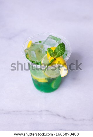 Lemon And Mint Mojito Cocktail In A Plastic Cup With Decoration 
