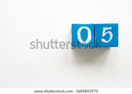 Number five with blue cubes over white background