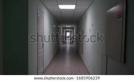 Bright corridor in the distance of the building. Light at the end of the tunnel.
Laboratory in an old hospital.