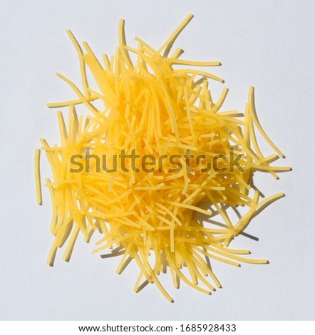 small pasta texture background closeup. vermicelli. raw small noodles