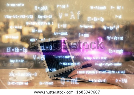 Double exposure of woman hands typing on computer and formula hologram drawing. Education concept.