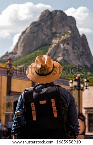 Tourist Peña de Bernal Mexico Views Young man watching with hat and backpack  Royalty-Free Stock Photo #1685958910