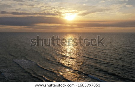 Aerial view of sunset over ocean. 
sky, clouds and water. beautiful serene scene