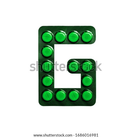 Medicine and education. Latin letter "G" laid out from tablets on a white isolated background.