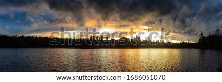 Burnaby, Greater Vancouver, British Columbia, Canada. Beautiful Panoramic View of Deer Lake during a colorful and vibrant winter sunset with Metrotown Buildings in the Background. Panorama HDR