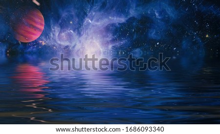 Beautiful unusual space planet in space reflected in water. galaxy stars night sky ,Elements of this Image Furnished by NASA ,