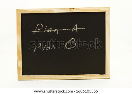 Handheld blackboard with the words Plan A and Plan B written on it isolated on a clear background image with copy space in horizontal format