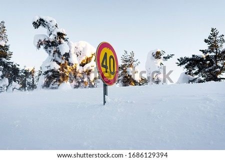 Sign 40, covered in snow 