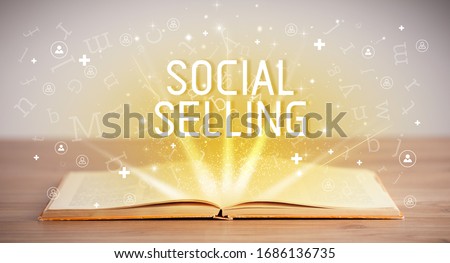 Open book with SOCIAL SELLING inscription, social media concept